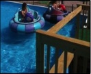 girls sitting on swimming balloon ,enjoying swimming at pool